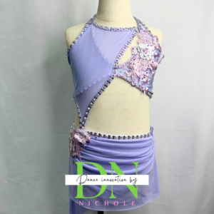 Purple costume with pink applique.